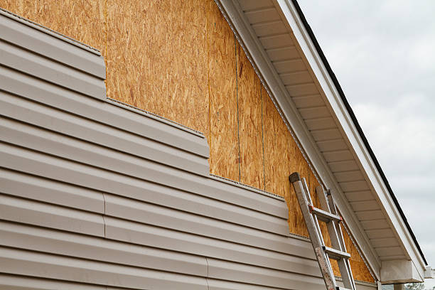 Professional Siding Installation technician working in Coram, NY